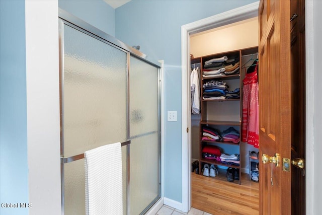 14 Maplecrest Dr, Ravena, NY 12143 - bathroom featuring a shower stall and a walk in closet