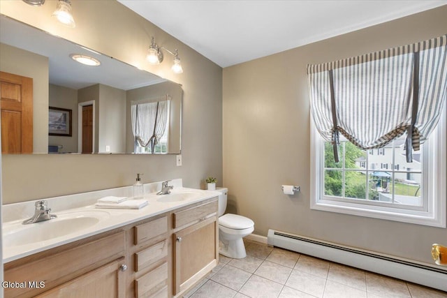 14 Maplecrest Dr, Ravena, NY 12143 - full bath featuring baseboard heating, double vanity, and tile patterned floors