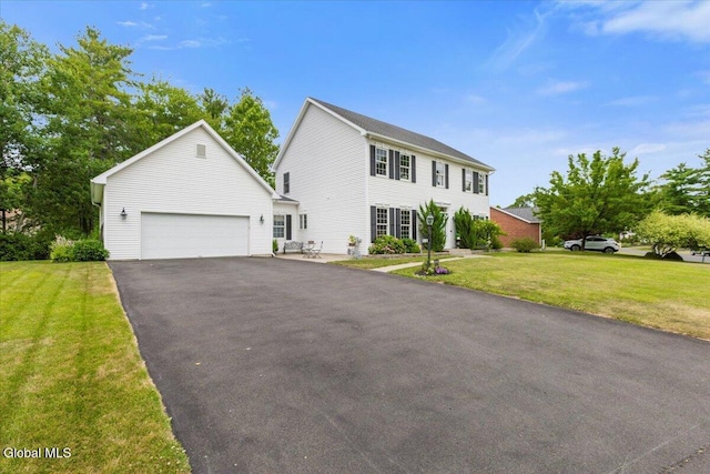 14 Maplecrest Dr, Ravena, NY 12143 - colonial house featuring a front lawn and asphalt driveway