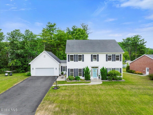 14 Maplecrest Dr, Ravena, NY 12143 - colonial inspired home with driveway, a front yard, and an attached garage