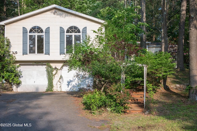 1072 Honey Hollow Rd, New Baltimore, NY 12058 - view of front facade with asphalt driveway and a garage