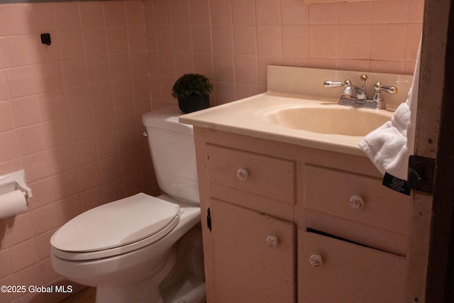 1072 Honey Hollow Rd, New Baltimore, NY 12058 - half bath featuring tile walls, vanity, and decorative backsplash