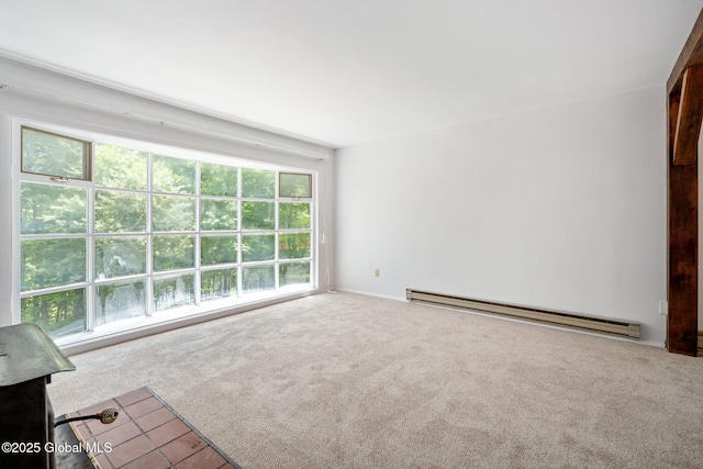 257 Lake Rd, Cobleskill, NY 12043 - unfurnished living room featuring a baseboard heating unit, carpet, and healthy amount of natural light