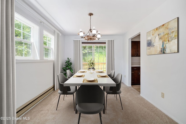 257 Lake Rd, Cobleskill, NY 12043 - dining room with a chandelier, light carpet, and baseboard heating