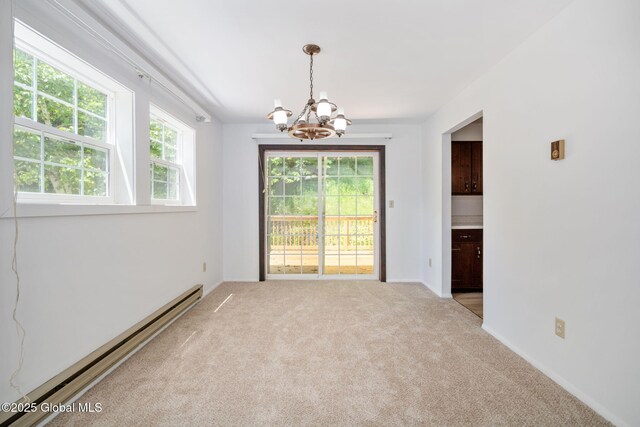 257 Lake Rd, Cobleskill, NY 12043 - unfurnished room with a baseboard radiator, a chandelier, and carpet floors