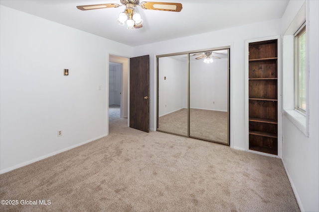 257 Lake Rd, Cobleskill, NY 12043 - unfurnished bedroom with carpet, a closet, and a ceiling fan