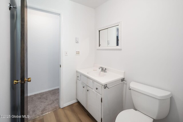 257 Lake Rd, Cobleskill, NY 12043 - half bathroom featuring wood finished floors and vanity