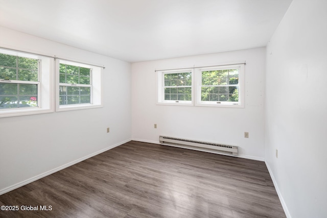 257 Lake Rd, Cobleskill, NY 12043 - empty room with a baseboard heating unit and wood finished floors