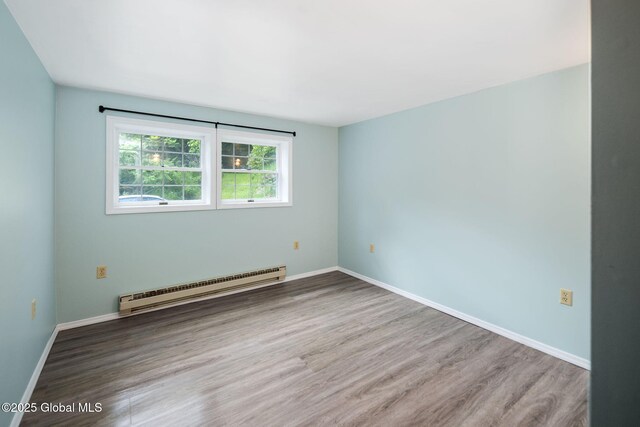 257 Lake Rd, Cobleskill, NY 12043 - empty room featuring baseboard heating and wood finished floors