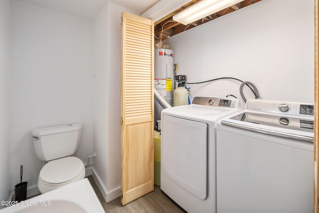 257 Lake Rd, Cobleskill, NY 12043 - laundry area featuring water heater, light wood-style flooring, and washing machine and dryer