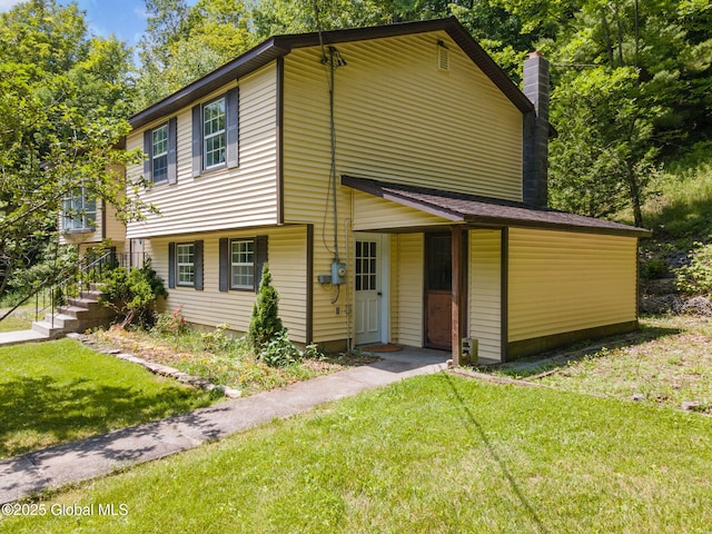 257 Lake Rd, Cobleskill, NY 12043 - view of front of house with a front yard and a chimney