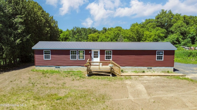 135 Lafayette St, Palatine Bridge, NY 13428 - manufactured / mobile home featuring a metal roof, crawl space, and a forest view