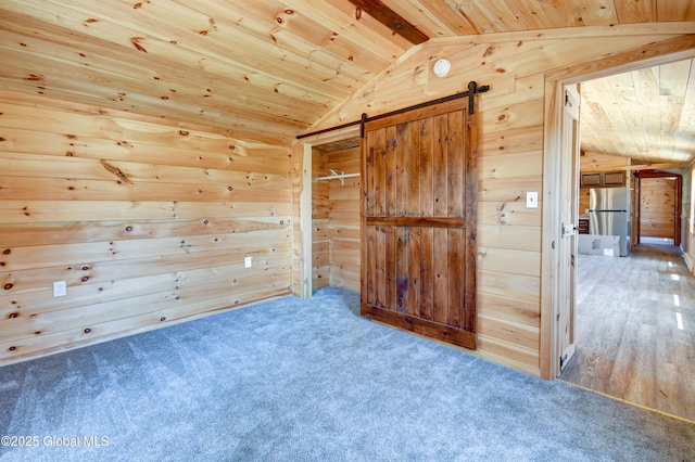 135 Lafayette St, Palatine Bridge, NY 13428 - unfurnished room with wood ceiling, a barn door, wood walls, and carpet flooring