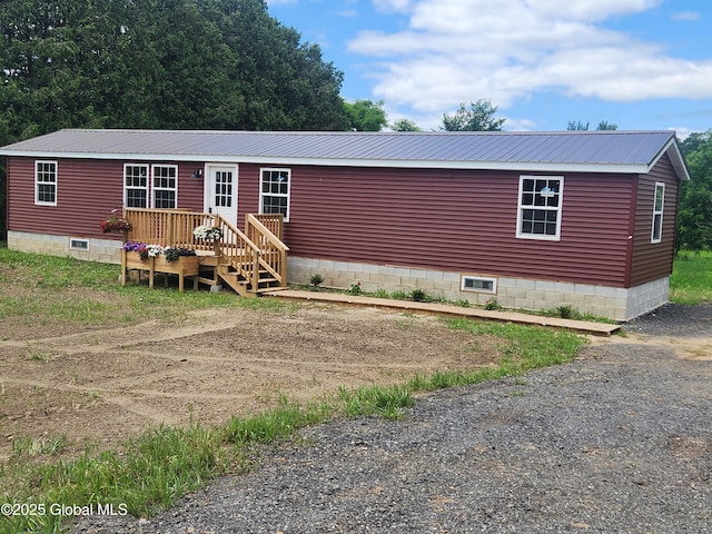 135 Lafayette St, Palatine Bridge, NY 13428 - manufactured / mobile home with a metal roof, crawl space, and a deck