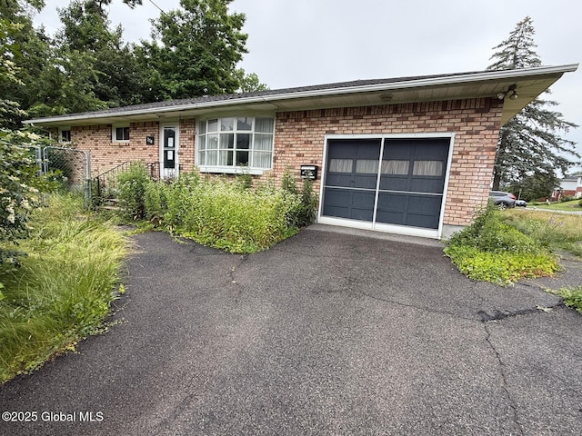 370 Partridge St, Albany, NY 12208 - ranch-style home with brick siding, an attached garage, and asphalt driveway