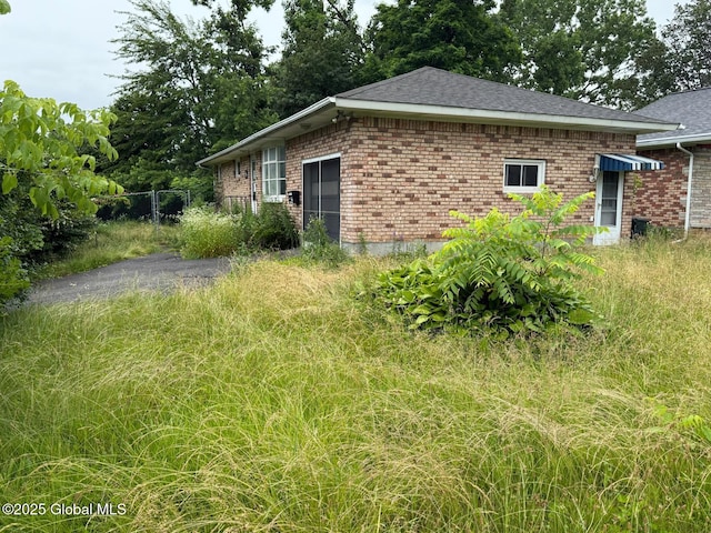 370 Partridge St, Albany, NY 12208 - view of property exterior with brick siding and roof with shingles