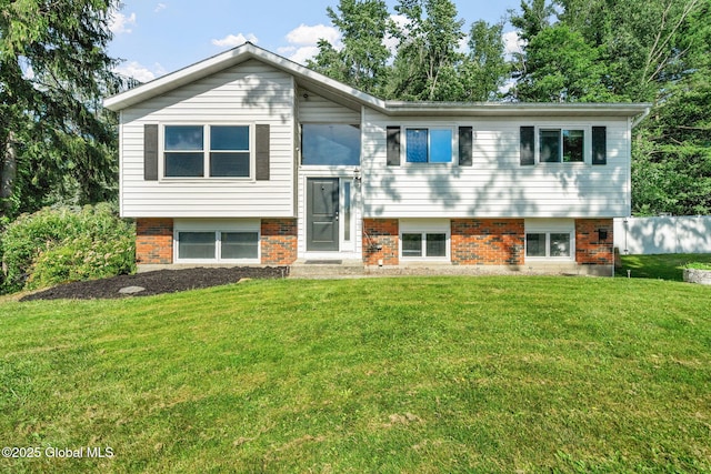 1 Tamarack Ln, East Greenbush, NY 12061 - bi-level home featuring a front yard and brick siding