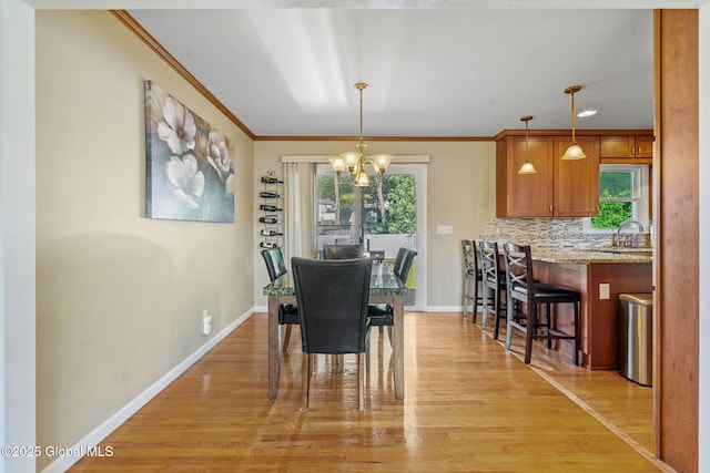 1 Tamarack Ln, East Greenbush, NY 12061 - dining room with a chandelier, crown molding, and light wood-style flooring