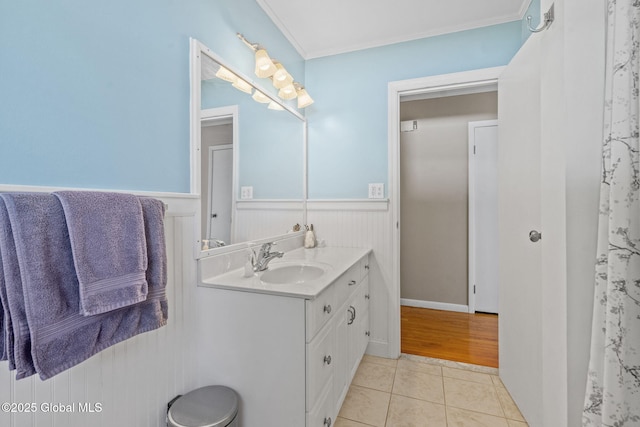 1 Tamarack Ln, East Greenbush, NY 12061 - full bath featuring vanity, wainscoting, tile patterned floors, and ornamental molding