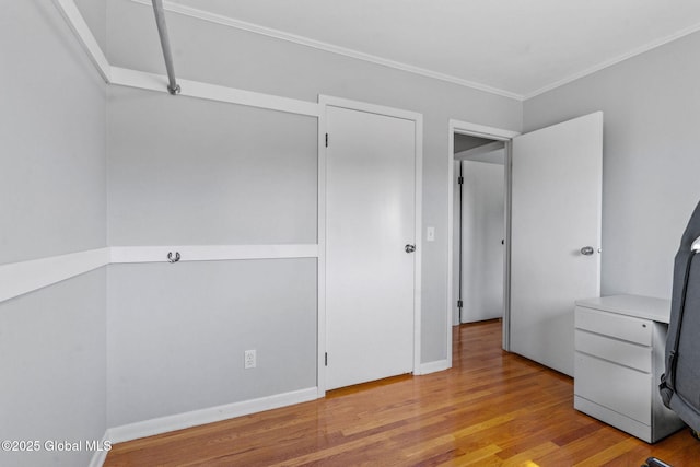 1 Tamarack Ln, East Greenbush, NY 12061 - unfurnished bedroom with wood finished floors, crown molding, and a desk
