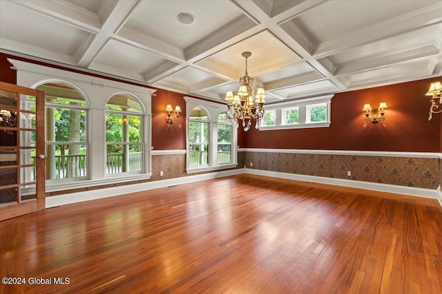 176 5th Ave, Saratoga Springs, Inside, NY 12866 - empty room featuring wood finished floors, a chandelier, wainscoting, coffered ceiling, and beamed ceiling