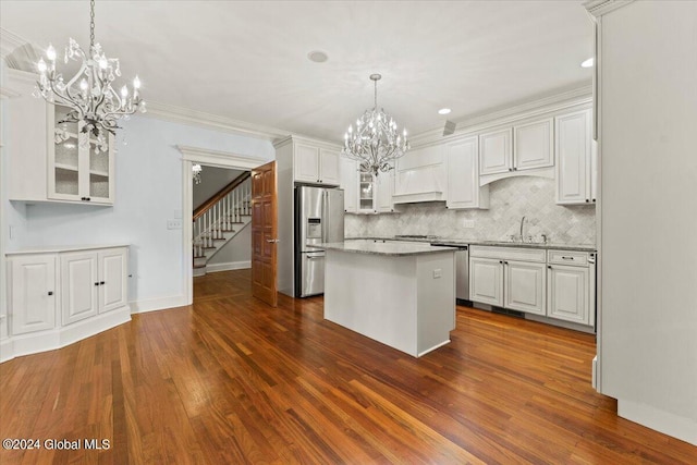 176 5th Ave, Saratoga Springs, Inside, NY 12866 - kitchen with stainless steel appliances, a chandelier, white cabinets, glass insert cabinets, and dark wood-type flooring