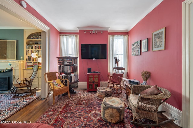 8 Front St, Schenectady, NY 12305 - living area featuring healthy amount of natural light, wood finished floors, ornamental molding, and a fireplace