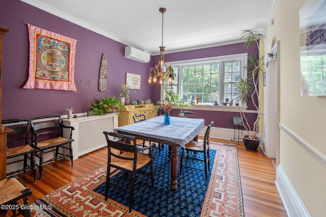 8 Front St, Schenectady, NY 12305 - dining area featuring a wall mounted AC, healthy amount of natural light, wood finished floors, and crown molding