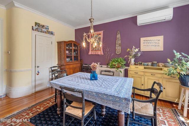 8 Front St, Schenectady, NY 12305 - dining area featuring a wall mounted AC, wood finished floors, ornamental molding, and a chandelier