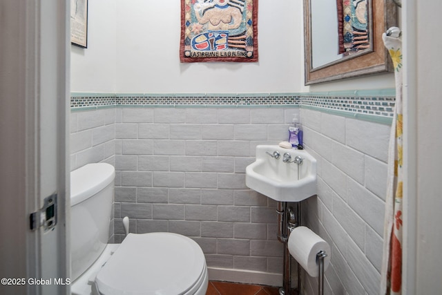8 Front St, Schenectady, NY 12305 - half bath featuring tile walls, wainscoting, and tile patterned flooring