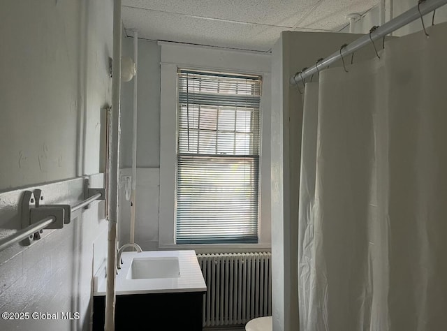 302-304 Quail St, Albany, NY 12208 - full bath with radiator, vanity, and curtained shower