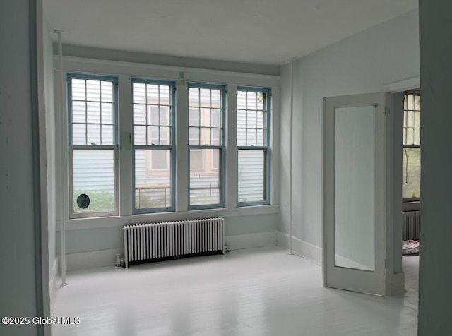 302-304 Quail St, Albany, NY 12208 - empty room featuring radiator heating unit