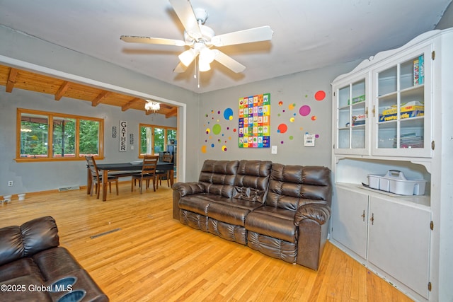 1101 Manas Dr, Schenectady, NY 12303 - living room featuring wood finished floors, ceiling fan, and beamed ceiling