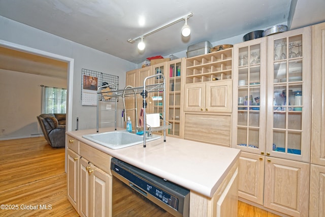 1101 Manas Dr, Schenectady, NY 12303 - kitchen featuring dishwasher, light brown cabinets, light wood-style flooring, and an island with sink