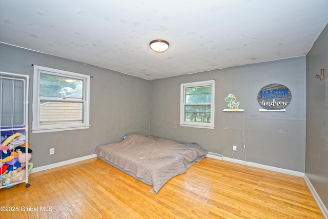 1101 Manas Dr, Schenectady, NY 12303 - bedroom featuring wood finished floors and baseboards