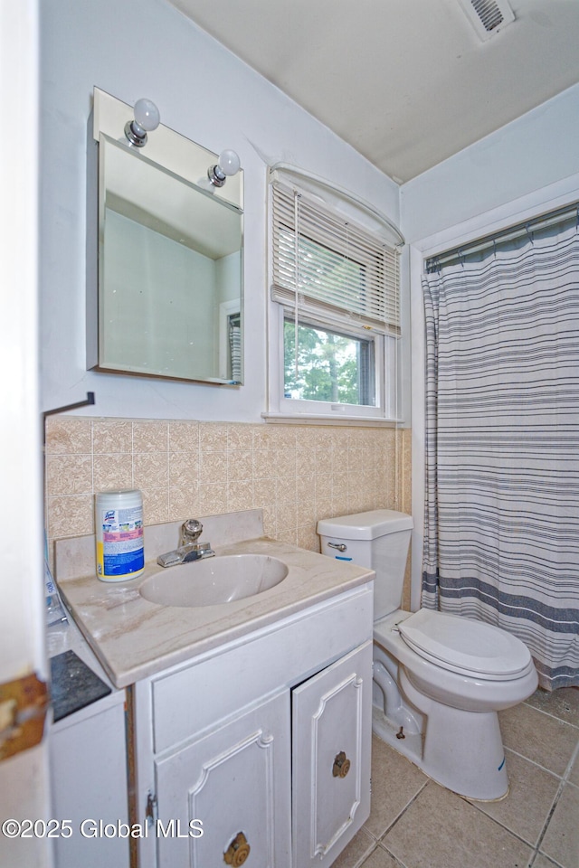 1101 Manas Dr, Schenectady, NY 12303 - bathroom featuring vanity, tile patterned floors, tile walls, and a shower with curtain