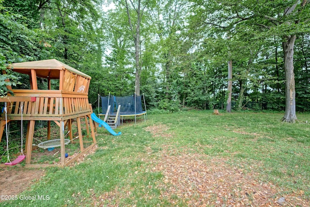 1101 Manas Dr, Schenectady, NY 12303 - view of grassy yard with a trampoline and a playground
