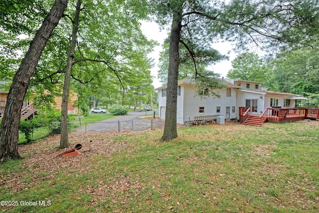 1101 Manas Dr, Schenectady, NY 12303 - view of green lawn with a wooden deck