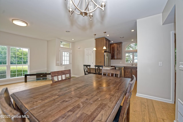 614 Apex Ln, Troy, NY 12182 - dining space featuring light wood-style flooring, recessed lighting, and a chandelier