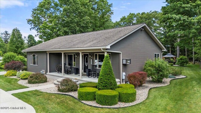1300 Burgoyne Ave, Hudson Falls, NY 12839 - back of house featuring a lawn, covered porch, roof with shingles, and a gazebo