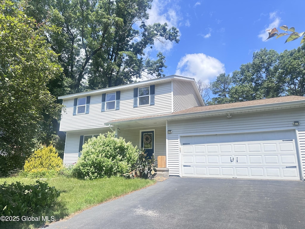 32 Tamarack Trl, Saratoga Springs, NY 12866 - traditional-style house with driveway and a garage
