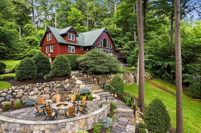 15 Green Harbour Ln, Lake George, NY 12845 - view of front facade with a fire pit, stairway, and a patio