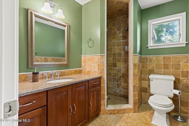 15 Green Harbour Ln, Lake George, NY 12845 - bathroom featuring tile walls, vanity, a shower stall, wainscoting, and tile patterned flooring