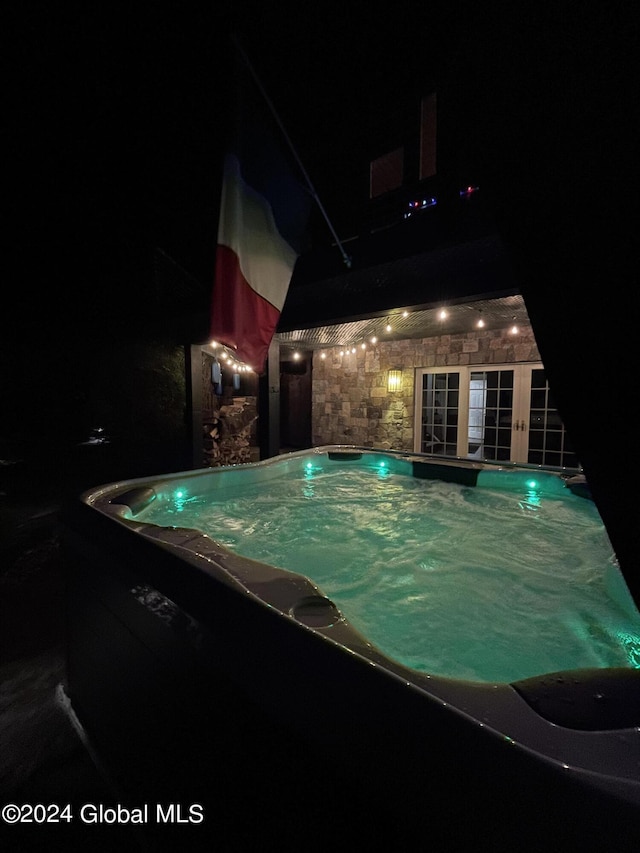 15 Green Harbour Ln, Lake George, NY 12845 - pool at night with french doors and a swimming pool
