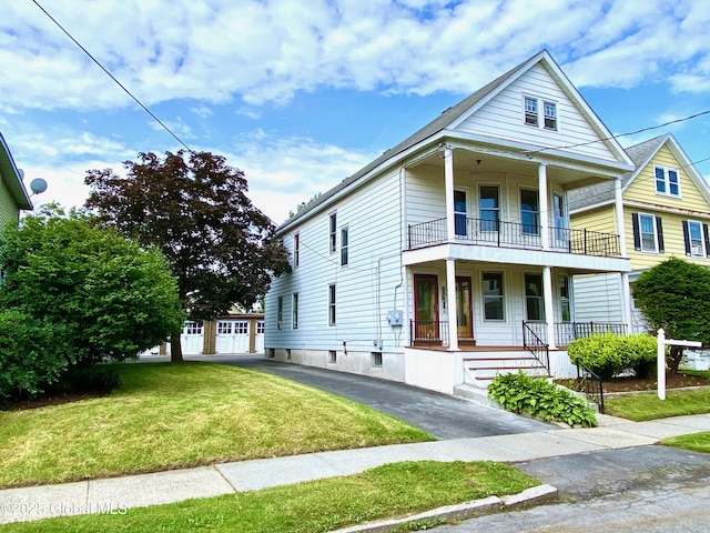 8 Mapleridge Ave, Albany, NY 12209 - view of front of house with covered porch, a balcony, and a front yard