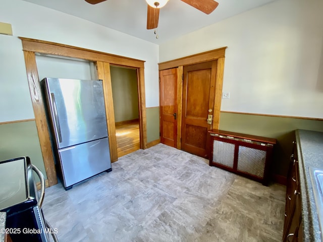 8 Mapleridge Ave, Albany, NY 12209 - kitchen with freestanding refrigerator, ceiling fan, and brown cabinets