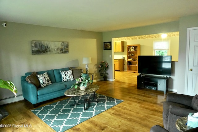 171 Consaul Rd, Colonie, NY 12205 - living area featuring a baseboard radiator and wood finished floors