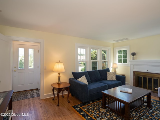 2 Arthur Rd, Colonie, NY 12110 - living room with wood finished floors and a brick fireplace