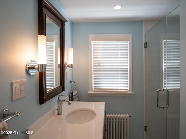 2 Arthur Rd, Colonie, NY 12110 - bathroom with radiator heating unit, vanity, and a shower stall