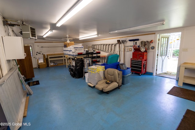 19 Meadow Rd, Hudson Falls, NY 12839 - garage with a heating unit, ceiling fan, and a workshop area